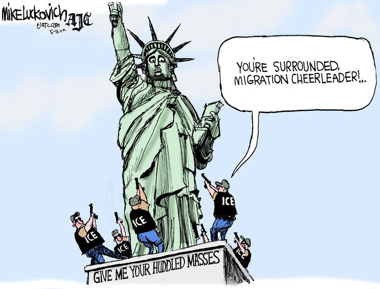 Lady Liberty atop her pedestal which reads 